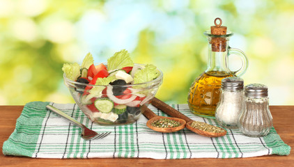 tasty greek salad on bright green background