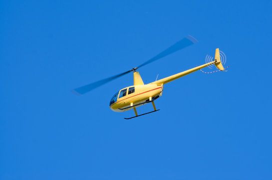 Yellow Robinson R-44 "Raven" helicopter