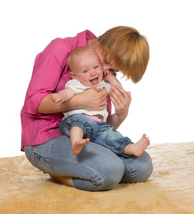 Mother with laughing 10 month old baby