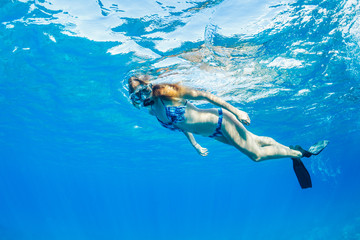 Woman Snorkeling in Tropical Ocean