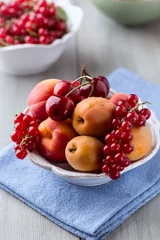 Fototapeten Bowl of mixed summer  fruits © B.G. Photography