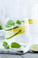 Glass of water with lime and lemon