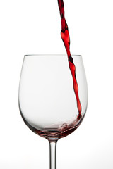 Small amount of red wine being poured