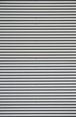 Obraz premium Front budynku z blachy falistej w formacie pionowym