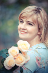 Fototapeta premium Happy smiling woman with flower