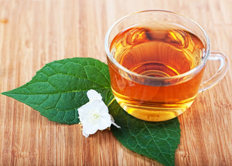 Hot tea and jasmine flower