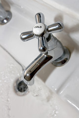 Chome faucet on white bath