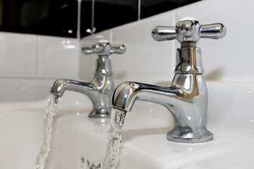 Chrome faucets with running water