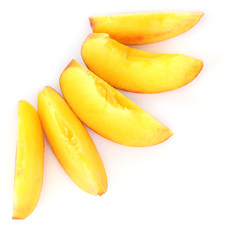 ripe peach slices isolated on white.
