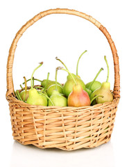 ripe pears in basket isolated on white.