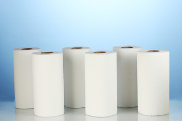 rolls of toilet paper on blue background