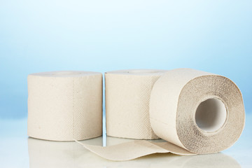 rolls of toilet paper on blue background