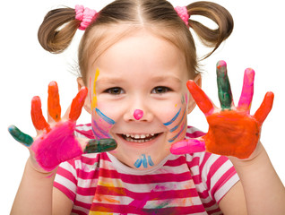 Portrait of a cute girl with painted hands