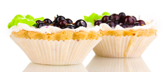 sweet cakes with berries isolated on white