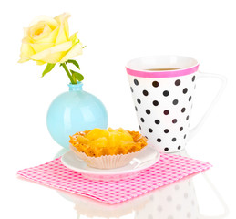 sweet cake with cup of tea isolated on white