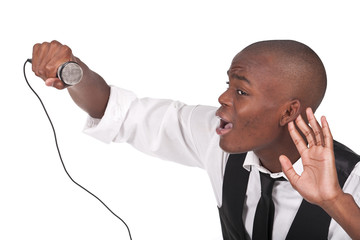 man singing with his hand behing the ear