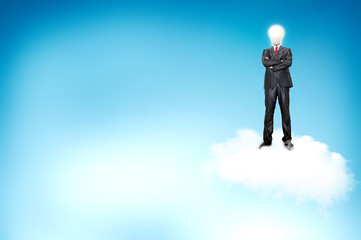 Young businessman with blub stand up on the clouds.