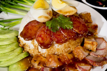 BBQ Pork and Crispy Pork with Rice on black background