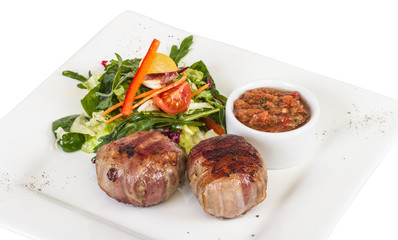 Grilled steak wrapped in bacon, with grilled vegetables, mashed