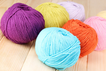 Knitting yarn on wooden background