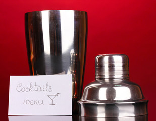 Cocktail shaker on red background