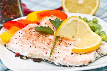 fillet of salmon with vegetables and green peas
