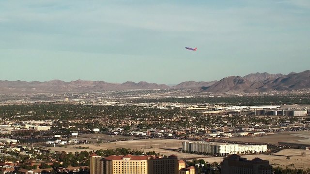 Outskirts of Las Vegas. Bird's-eye view. Plane taking off.