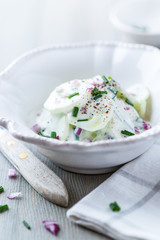 Cucumber with yogurt, chive and onion