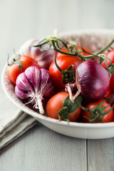 Bowl of tomatoes, garlic and onion