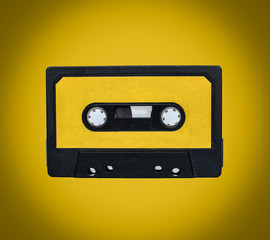 Retro cassete on yellow background