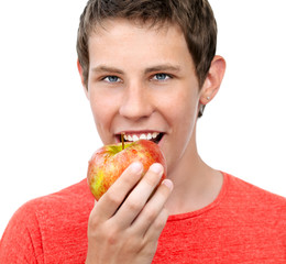 young boy eating a red apple