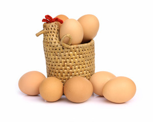 Eggs in hen basket on a white background