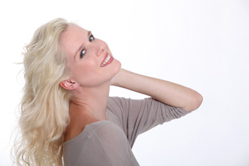 Naklejka premium Confident blond woman posing on a white background