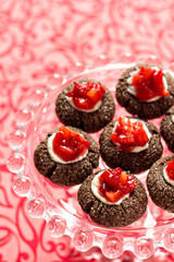 Chocolate thumbprint cookies with cream cheese and strawberries