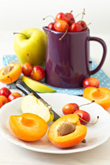 Different fruits and berries on white table