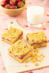 Strawberry crumb cake with a glass of milk