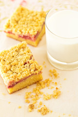 Strawberry crumb cake with a glass of milk