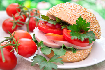 Healthy ham sandwich with  tomatoes and lettuce
