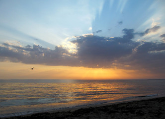 Sunset and beams over the sea
