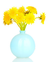 Dandelion flowers in vase isolated on white