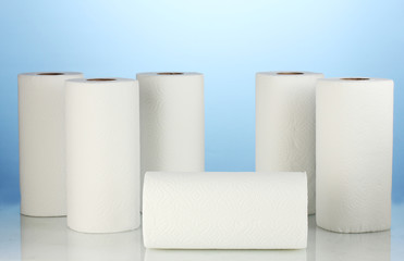 rolls of toilet paper on blue background