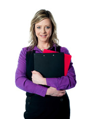 Beautiful smiling woman holding documents