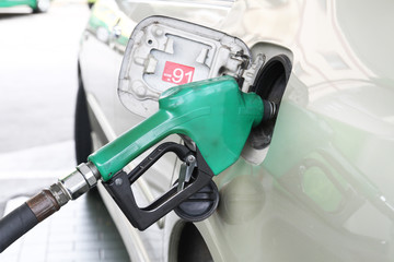 Car is filling gasoline at gas station