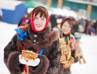 girls  with pancake during  Shrovetide