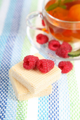 Tea with raspberries and waffles