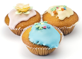 Cupcakes decorated with colored sugar on white base