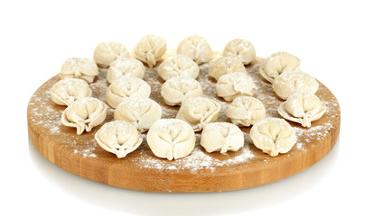 Raw Dumplings on cutting board isolated on white