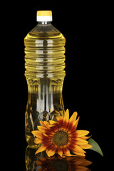 sunflower oil in a plastic bottle isolated on black background