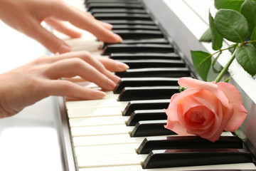 Fototapeta premium hands of woman playing synthesizer