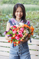 woman face holding bouquet flowers in hand